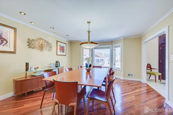 a view of a patio with table and chairs and potted plants