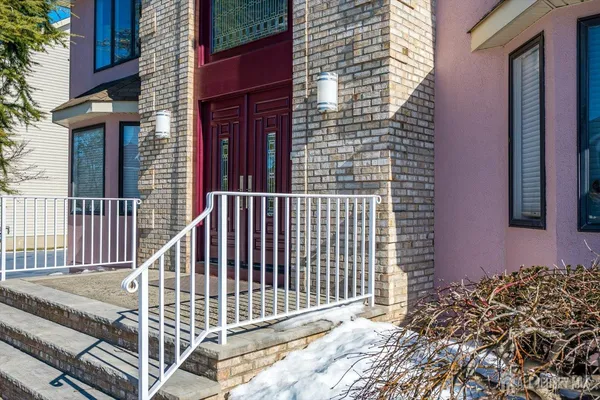 a living room with furniture and a piano