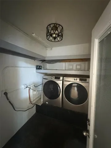 a view of a room with washer and dryer