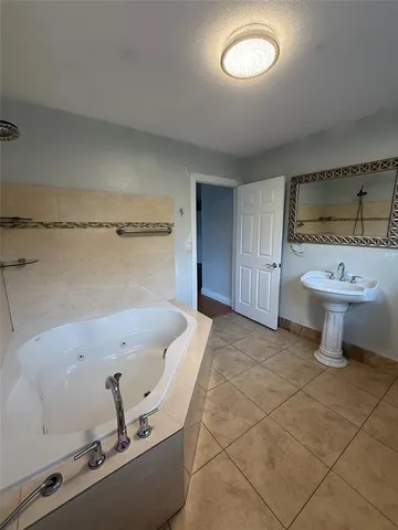 view of a room with a sink and mirror