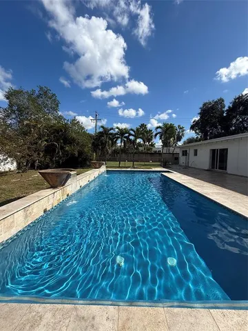 a view of outdoor space with swimming pool