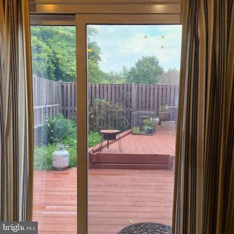 a view of a wooden door and a yard
