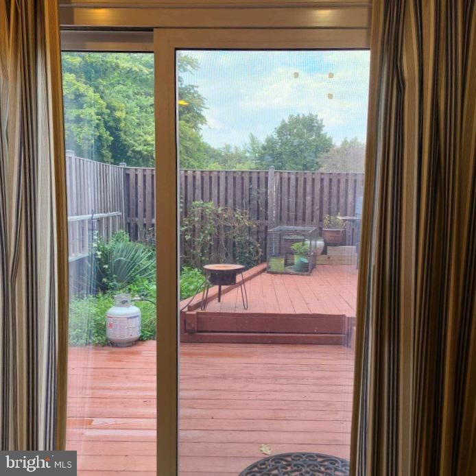 a view of a wooden door and a yard