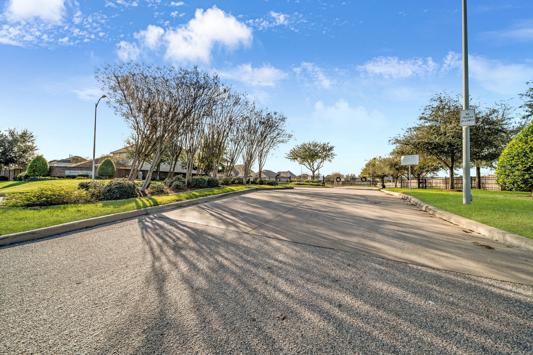 14212 Portrait Court Houston, TX 77045 - Photo 27 of 27 Secure and serene gated community offering privacy and peace of mind.