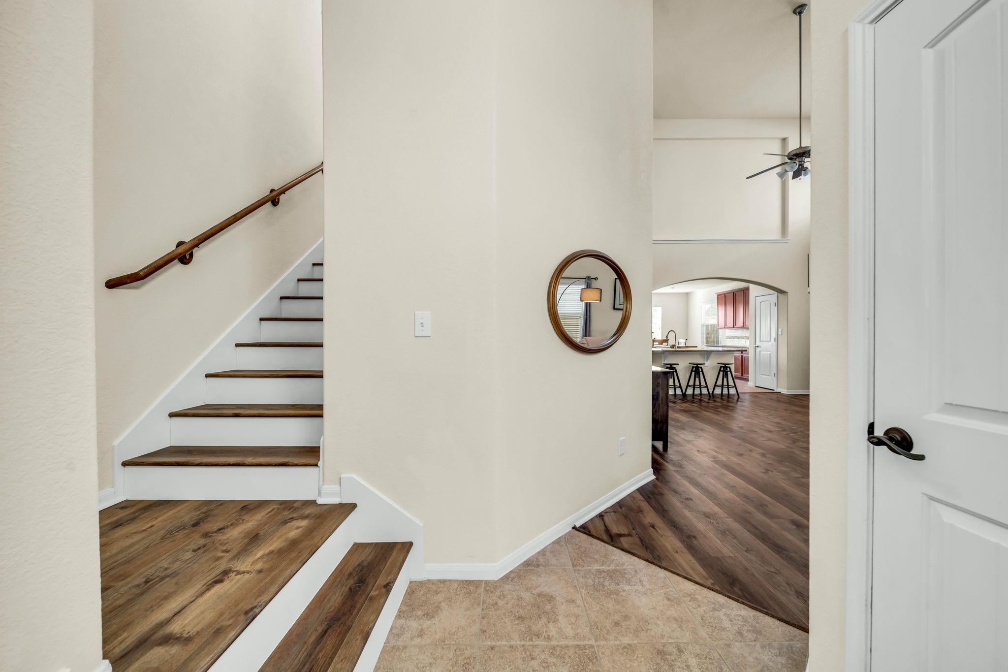 14212 Portrait Court Houston, TX 77045 - Photo 3 of 27 Elegant hardwood floors seamlessly unite the space for a warm, inviting ambiance.