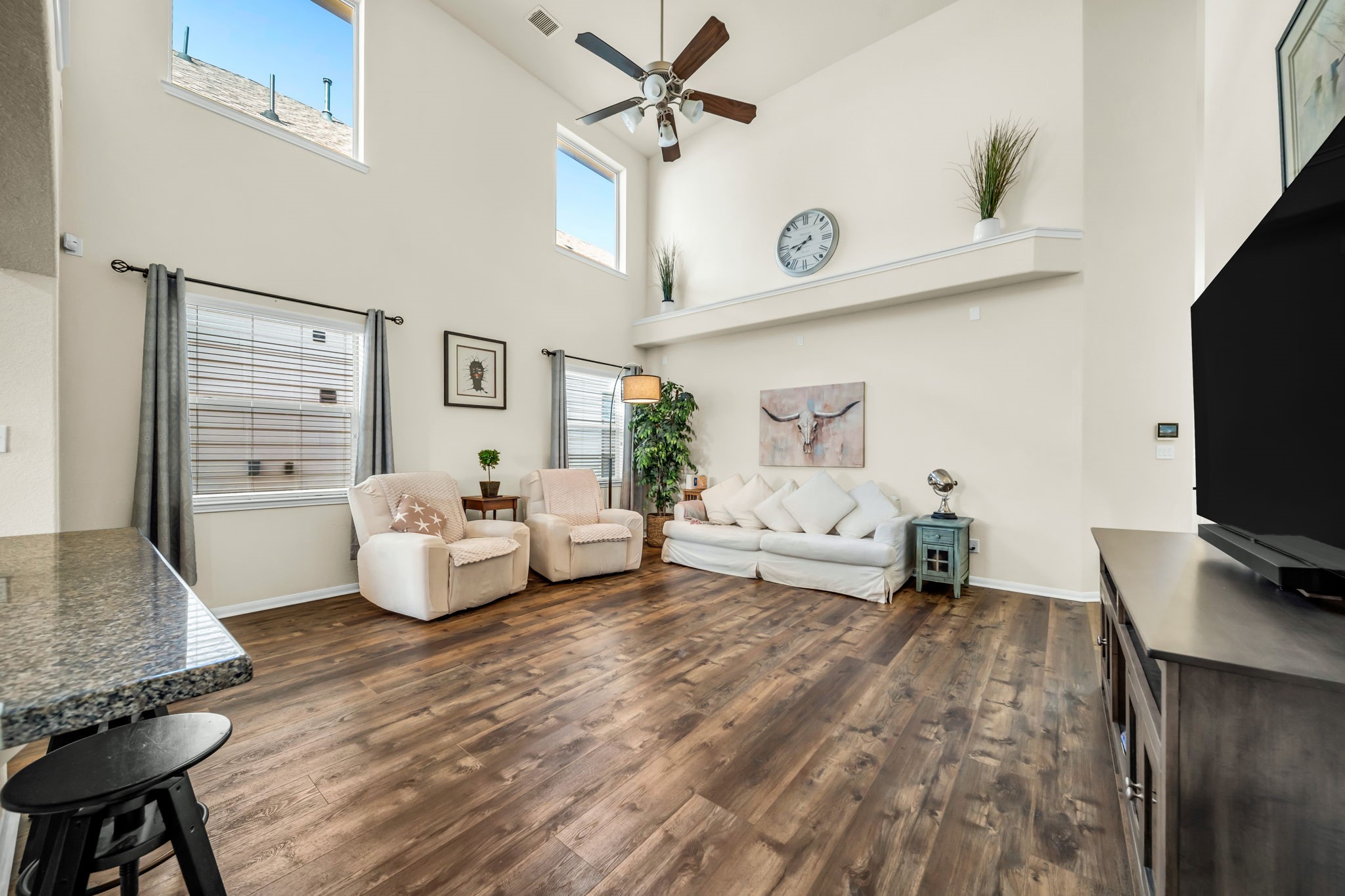 14212 Portrait Court Houston, TX 77045 - Photo 5 of 27 Experience the grandeur of high ceilings, enhancing the spacious and airy feel of this inviting living area.