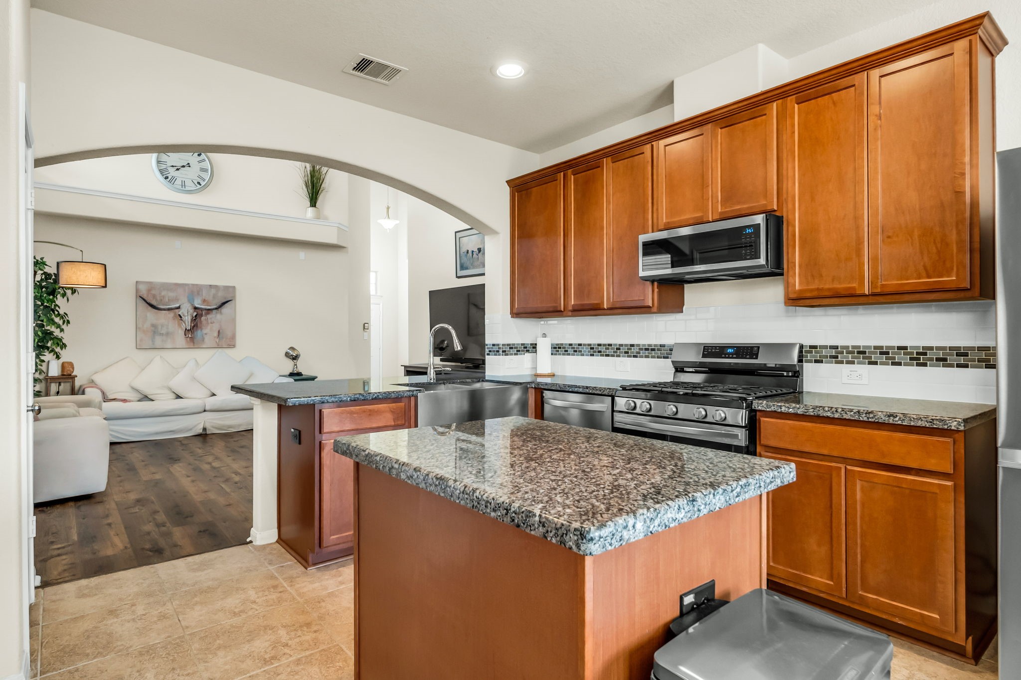 14212 Portrait Court Houston, TX 77045 - Photo 8 of 27 Experience culinary elegance in a kitchen featuring sleek granite countertops.