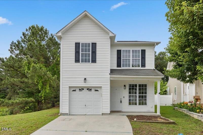 3831 Pin Oak Road Raleigh, NC 27604 - Photo 1 of 24 a view of a house with a yard