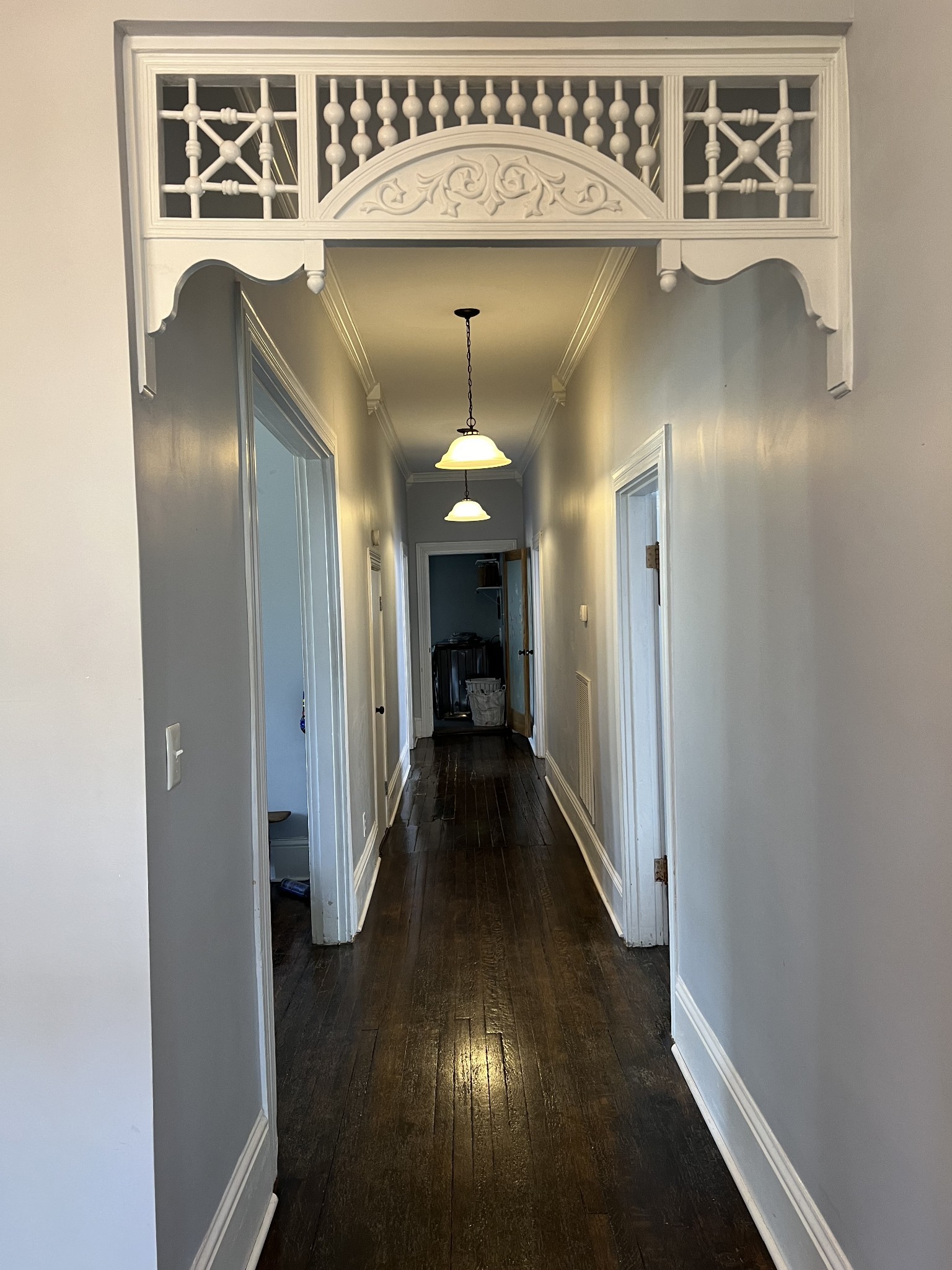 201 Pleasant Street Mount Pleasant, TN 38474 - Photo 9 of 38 a view of a hallway with wooden floor and a cabinet