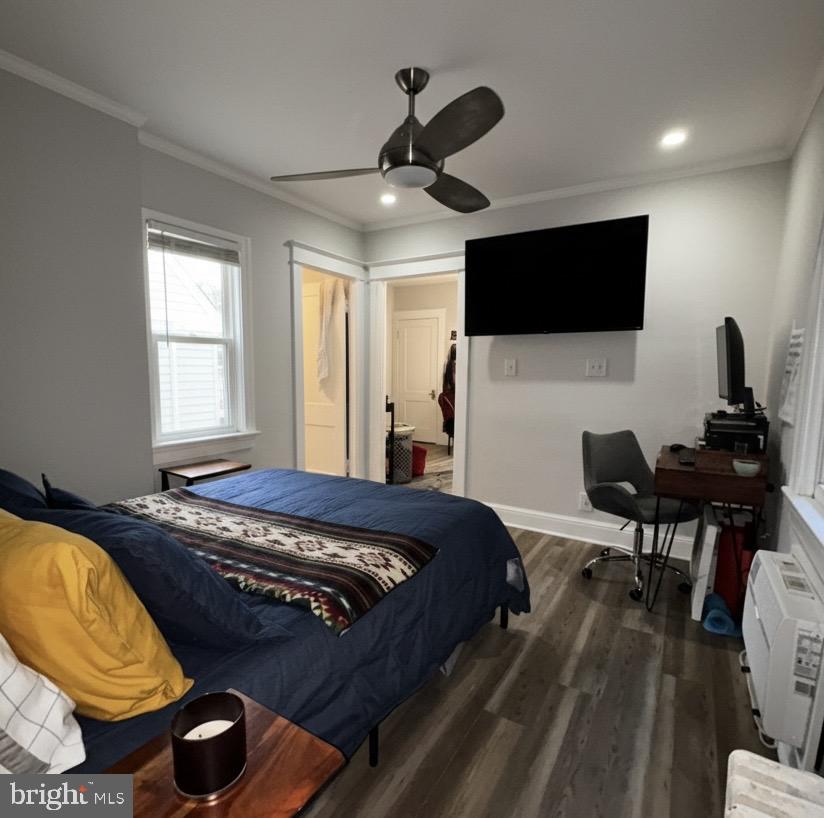 414 Seward Square Southeast, Unit 104 Washington, DC 20003 - Photo 4 of 6 a bedroom with a bed and a flat screen tv