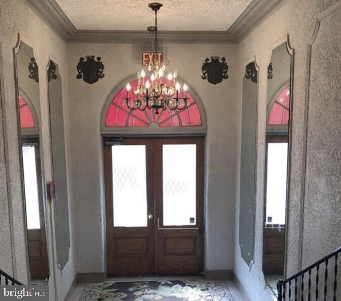 414 Seward Square Southeast, Unit 104 Washington, DC 20003 - Photo 6 of 6 a view of a entryway door and chandelier