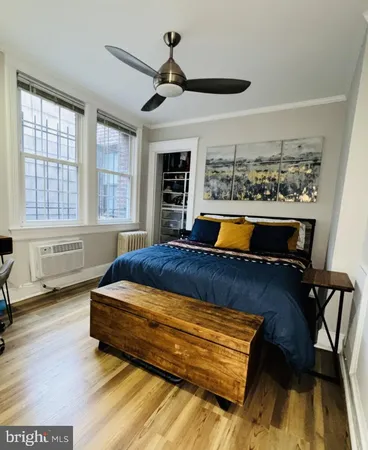 a room with wooden floor and furniture