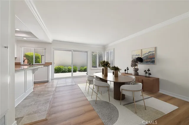 a large living room with stainless steel appliances granite countertop a couch and a coffee table