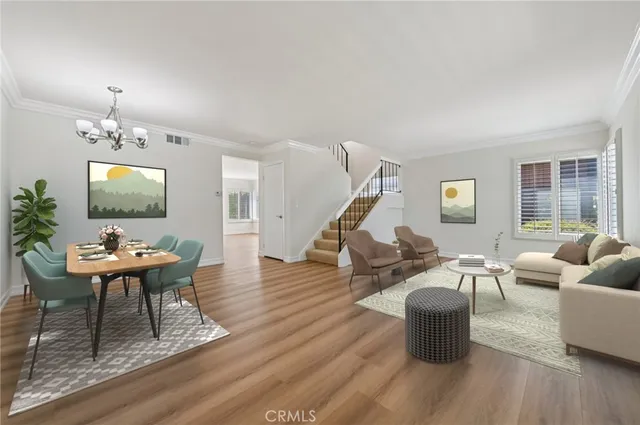 a living room with furniture a rug and a flat screen tv