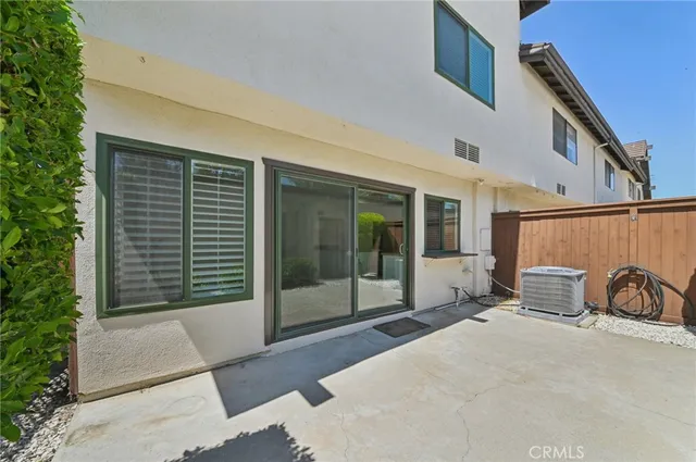 a balcony with table and chairs