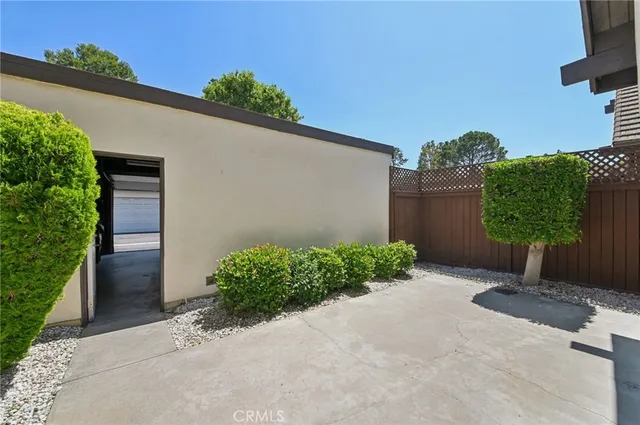 a backyard of a house with a garage