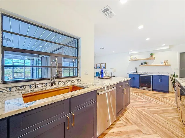 a utility room with a sink dryer and washer