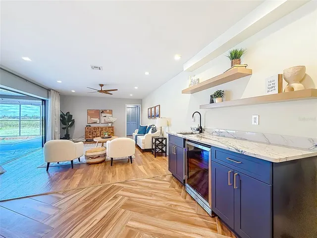 a view of hallway with wooden floor and stairs