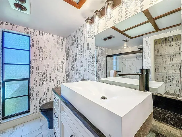 a view of a living room and bathroom