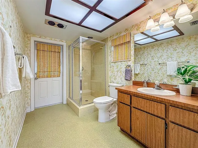 a swimming pool with outdoor seating and yard