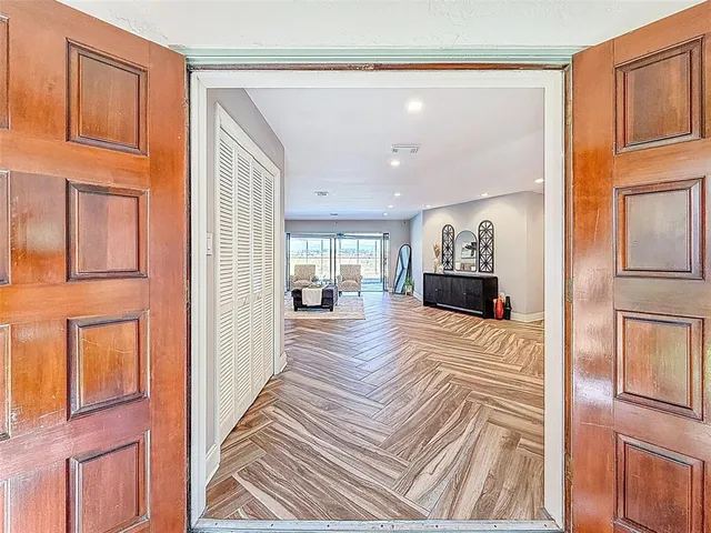 a bedroom with a bed and glass window