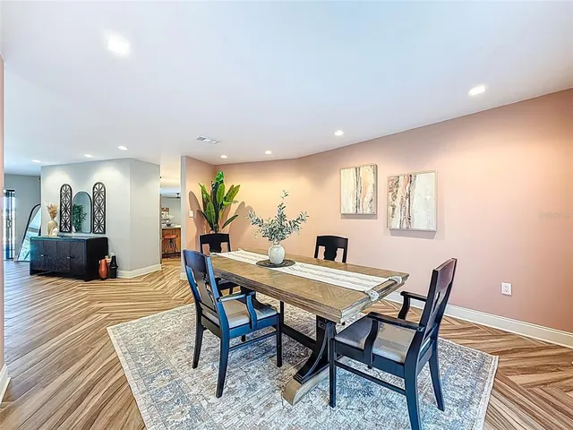 a view of a livingroom with furniture and an entryway