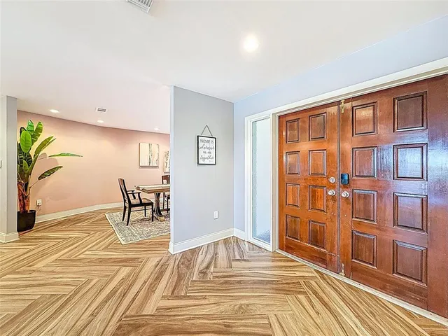 a view of living room with furniture and wooden floor