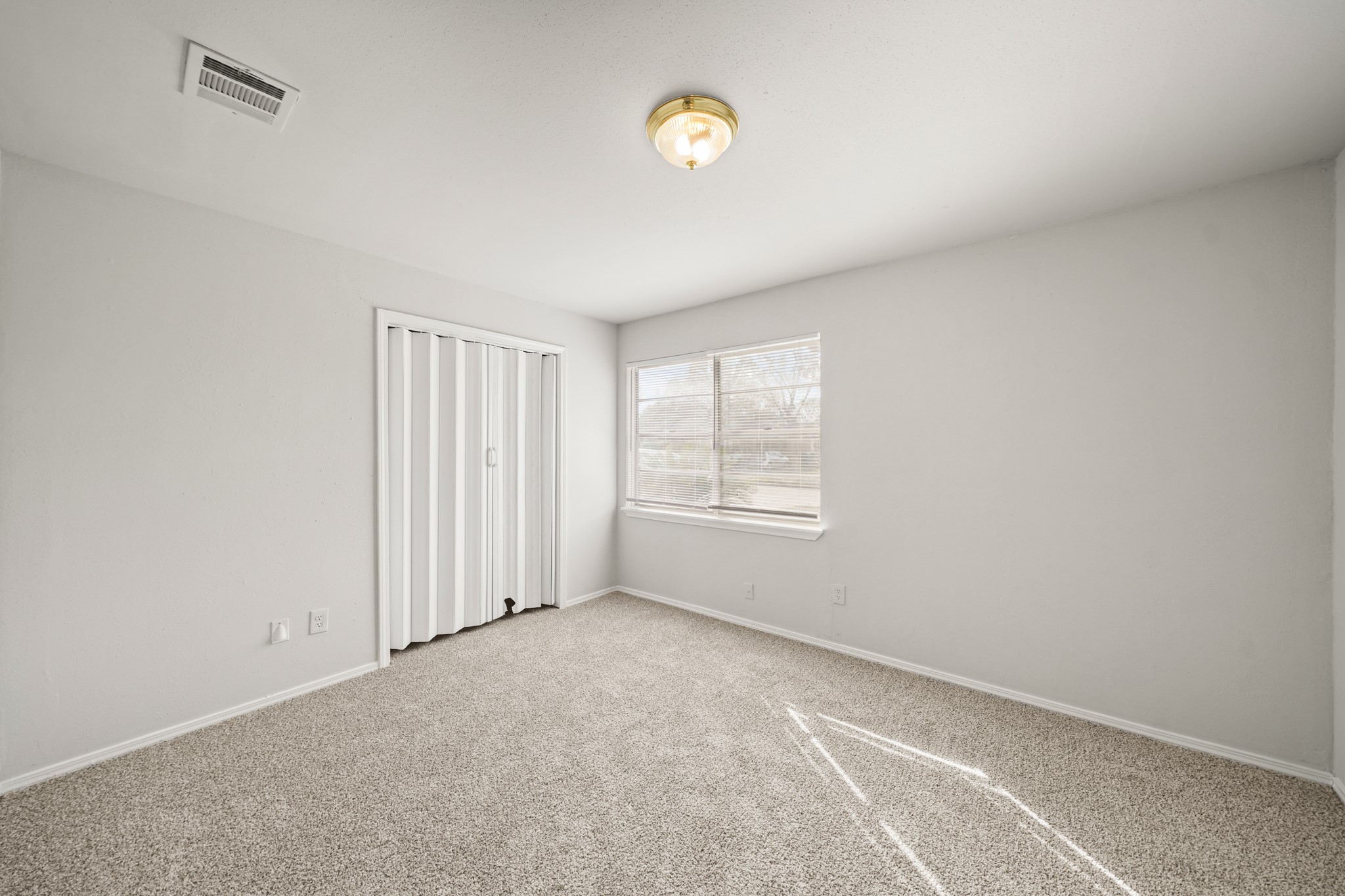 14415 Insley Street Houston, TX 77045 - Photo 6 of 12 a view of an empty room with a window