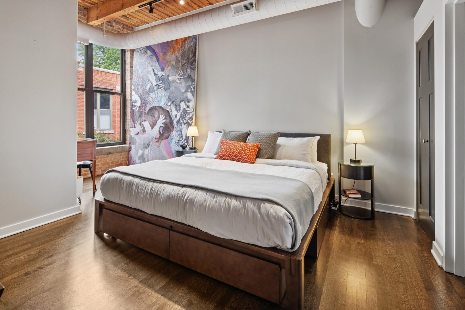2222 North Racine Avenue, Unit 16 Chicago, IL 60614 - Photo 13 of 32 a bedroom with a bed and wooden floor