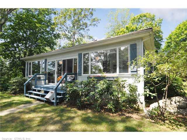 14 Flanders Road Stonington, CT 06378 - Photo 1 of 1 front view of a house with a yard