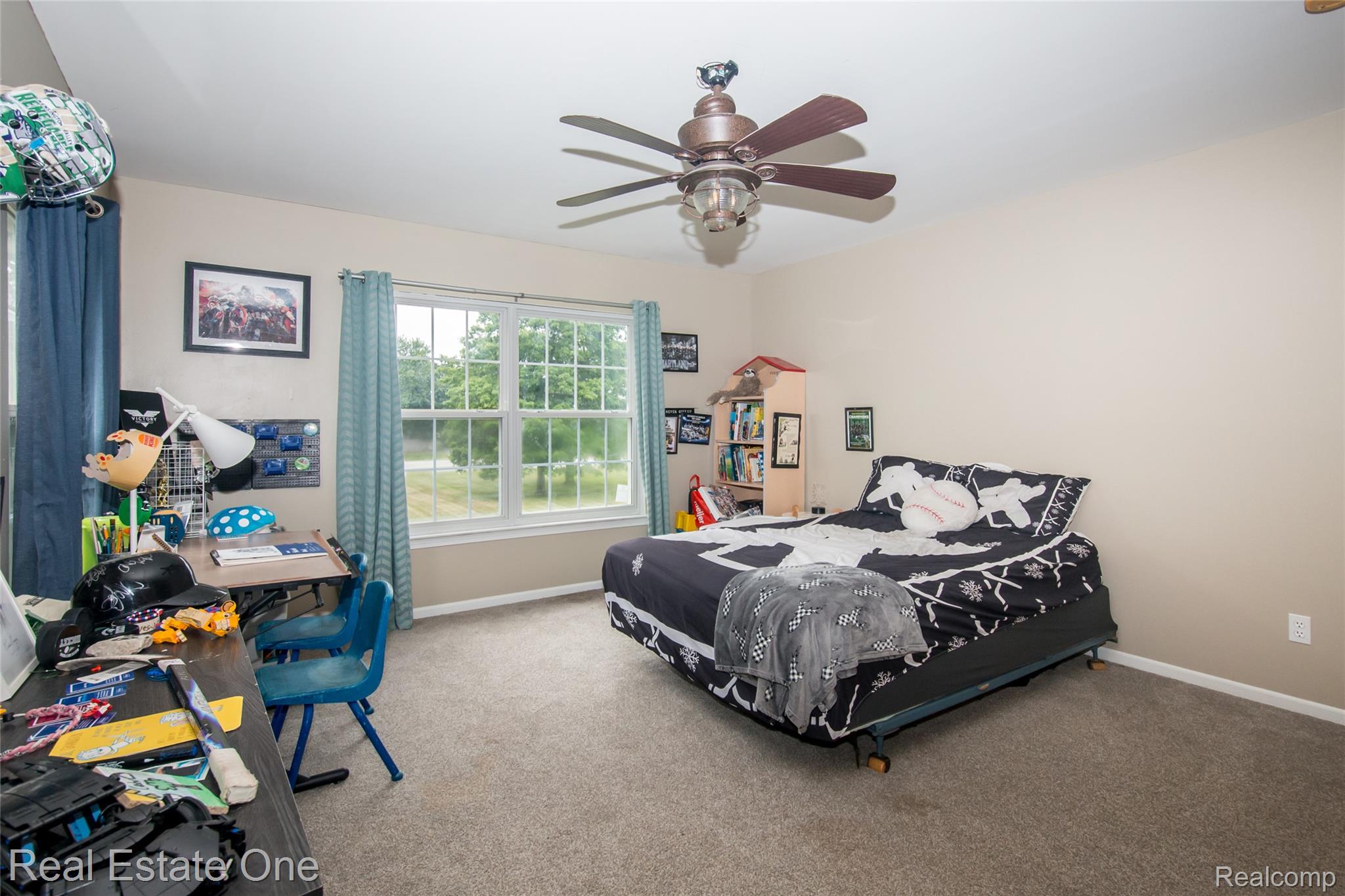 145 Stockbridge Road South Webberville, MI 48892 - Photo 26 of 35 Carpeted room featuring a double window, ceiling fan with integrated lighting, and neutral wall paint