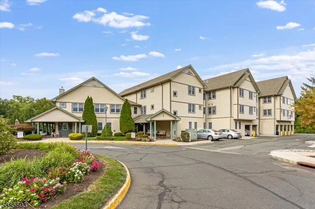a view of multiple houses with a yard