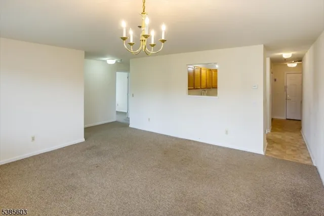 a view of a hallway with a chandelier