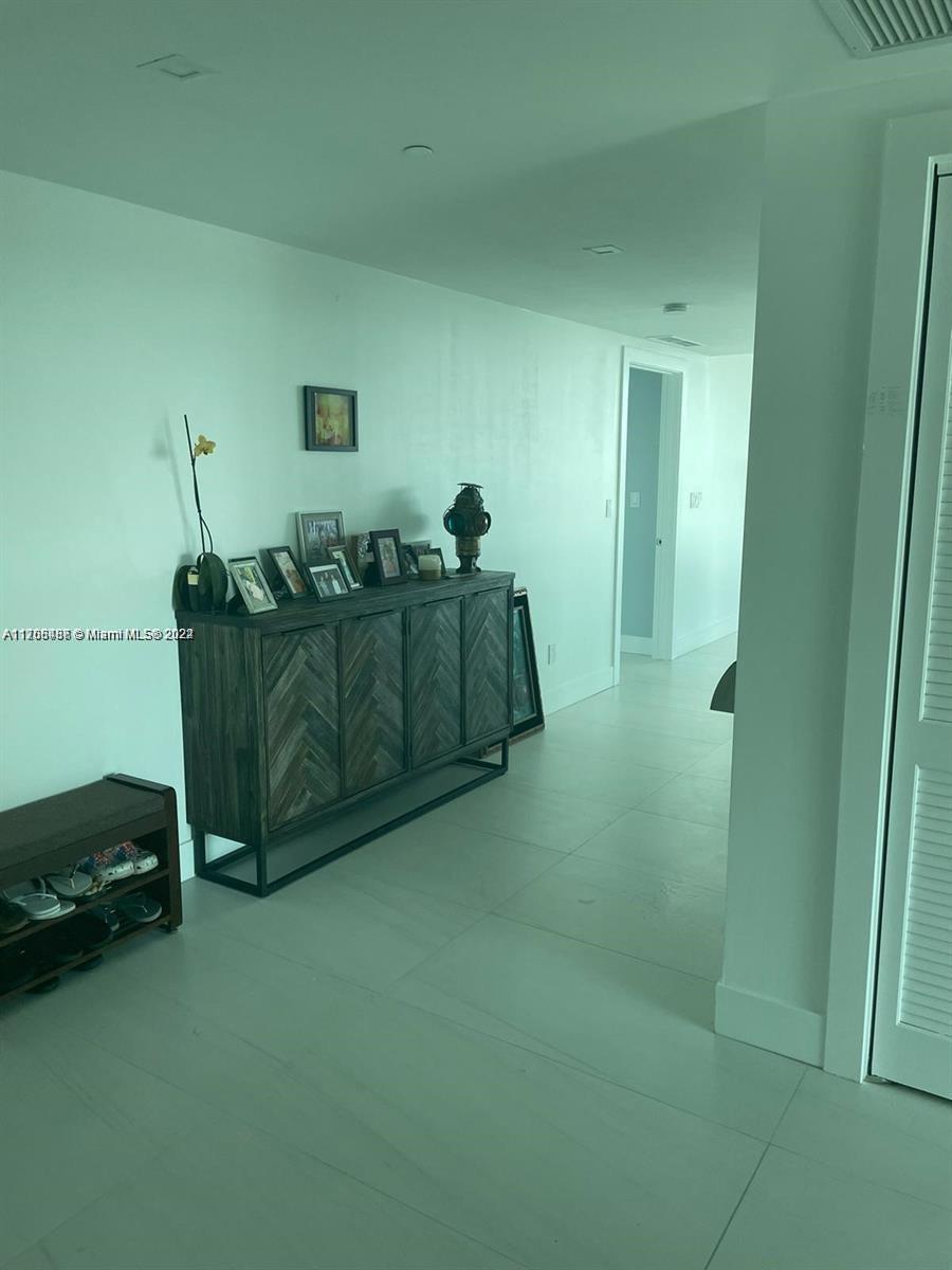 730 North Ocean Boulevard, Unit 1205 Pompano Beach, FL 33062 - Photo 12 of 19 a living room with furniture