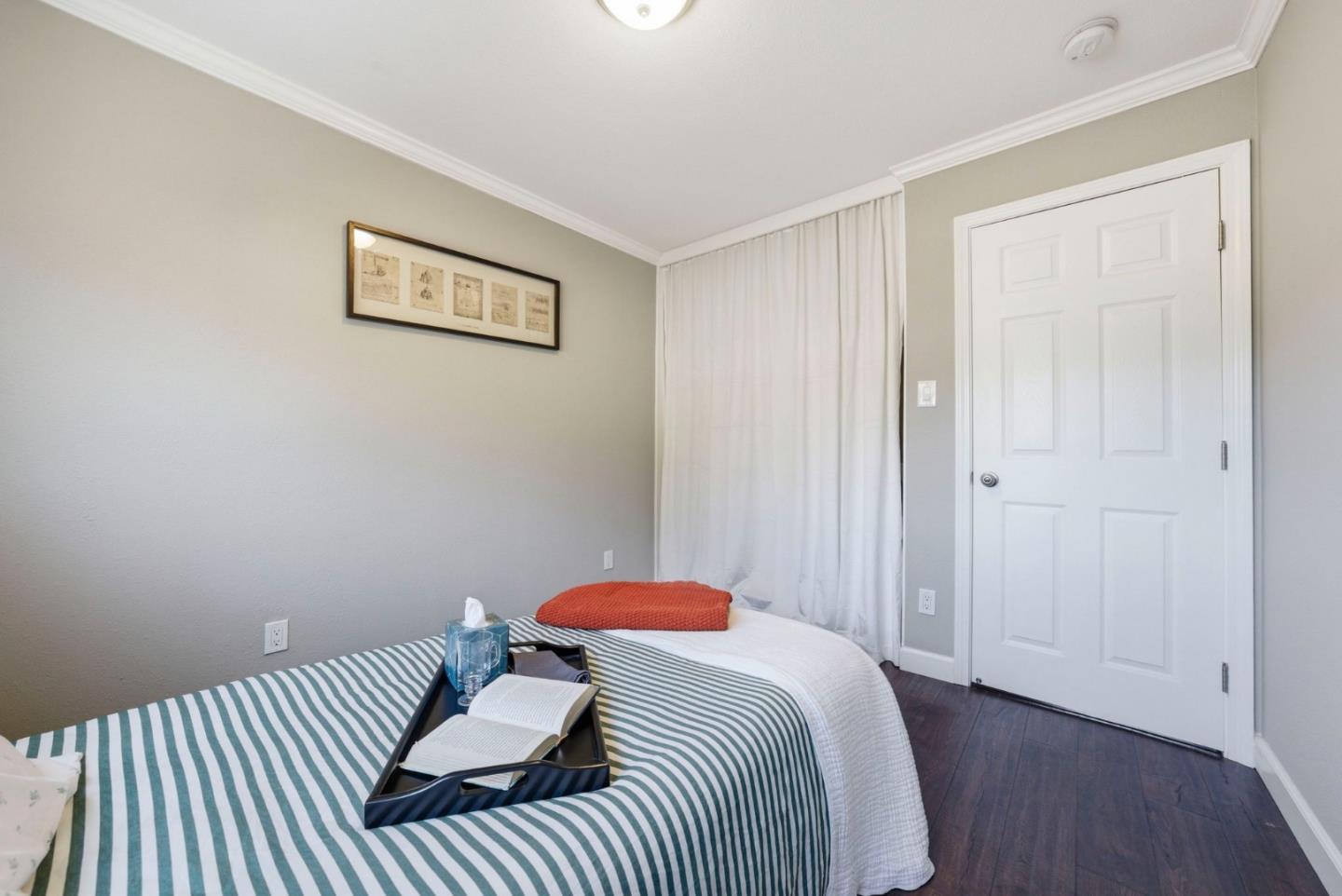 2793 Ruff Court Pinole, CA 94564 - Photo 20 of 53 a bedroom with a bed and wooden floor