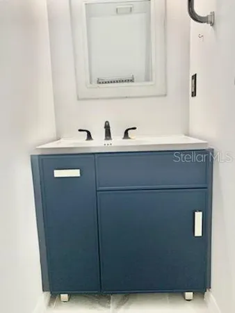 a view of a hallway with stairs