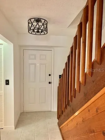 a view of an empty room and wooden floor