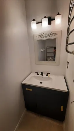 a view of a backyard with a garden and garage