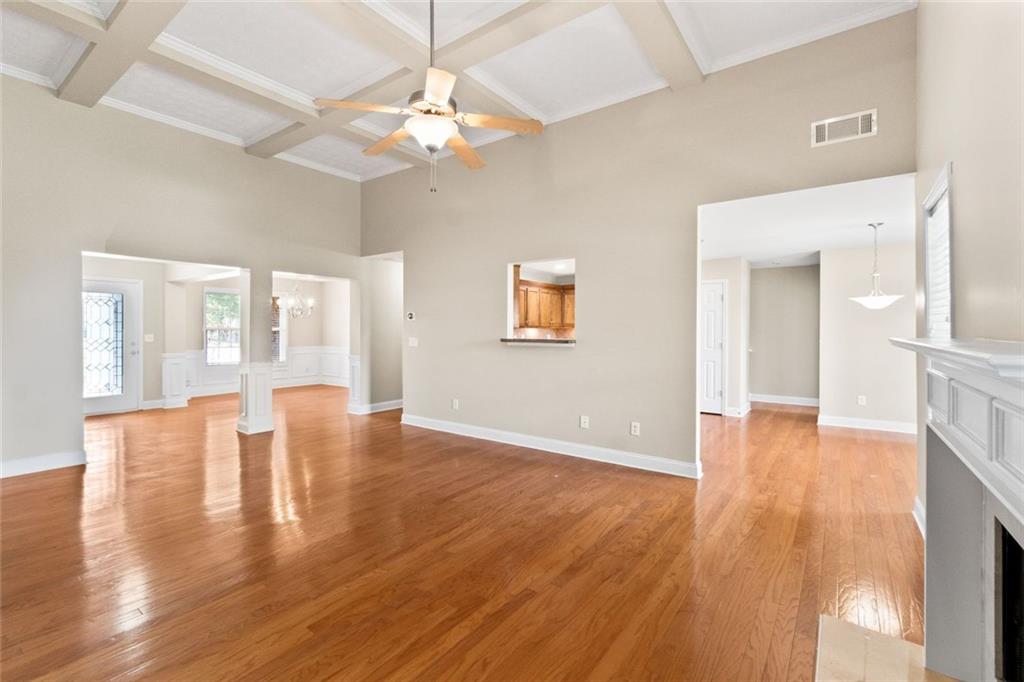 241 Red Bud Road Jefferson, GA 30549 - Photo 17 of 43 a view of an empty room with wooden floor and a large window