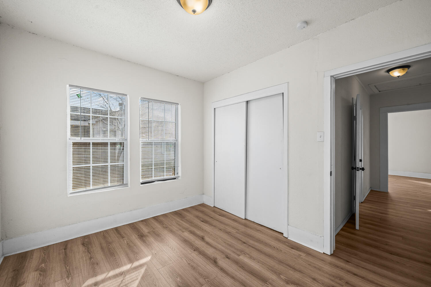 620 South 11th Street Slaton, TX 79364 - Photo 15 of 22 a view of empty room with wooden floor and fan