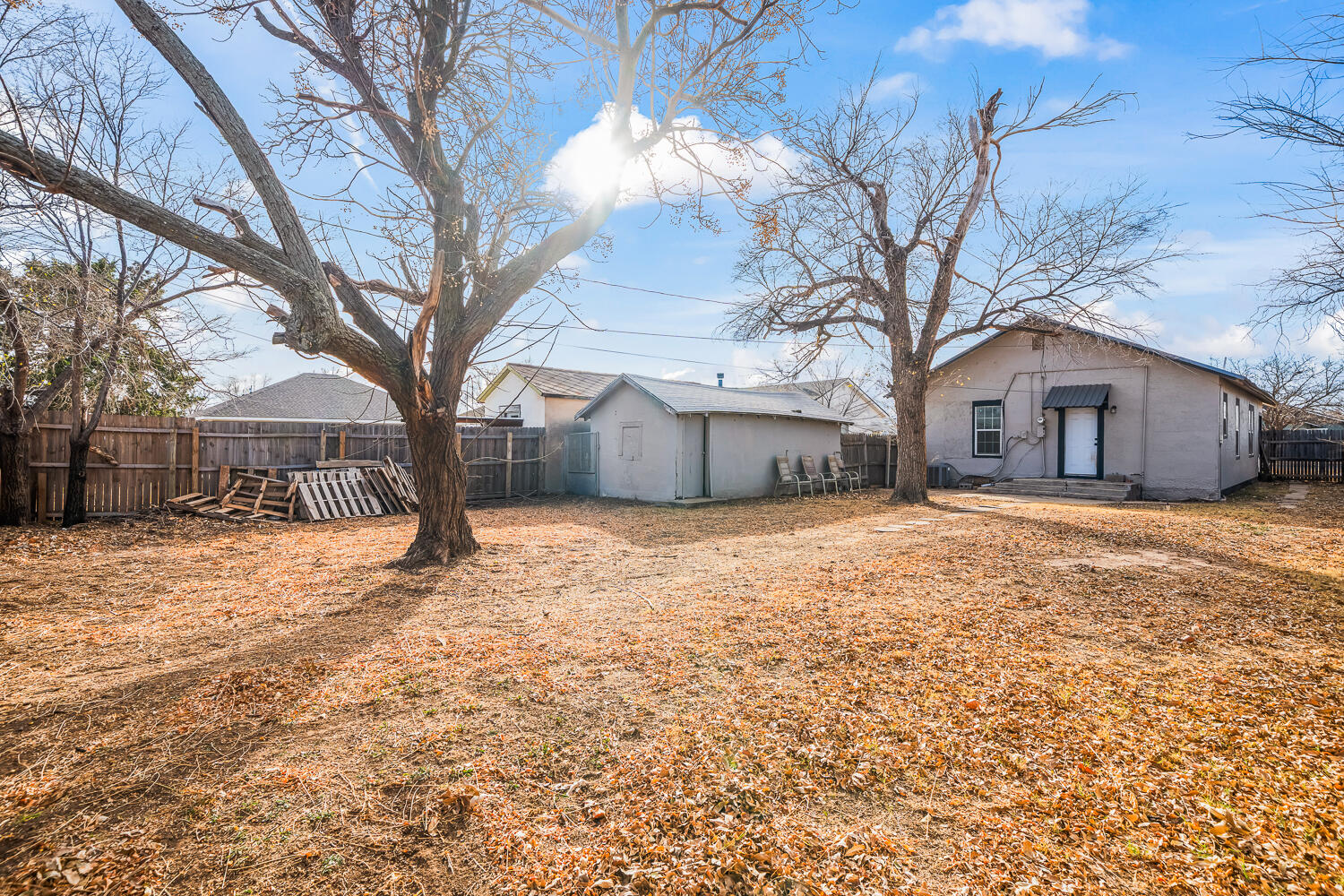 620 South 11th Street Slaton, TX 79364 - Photo 22 of 22 a house that has a tree in front of it