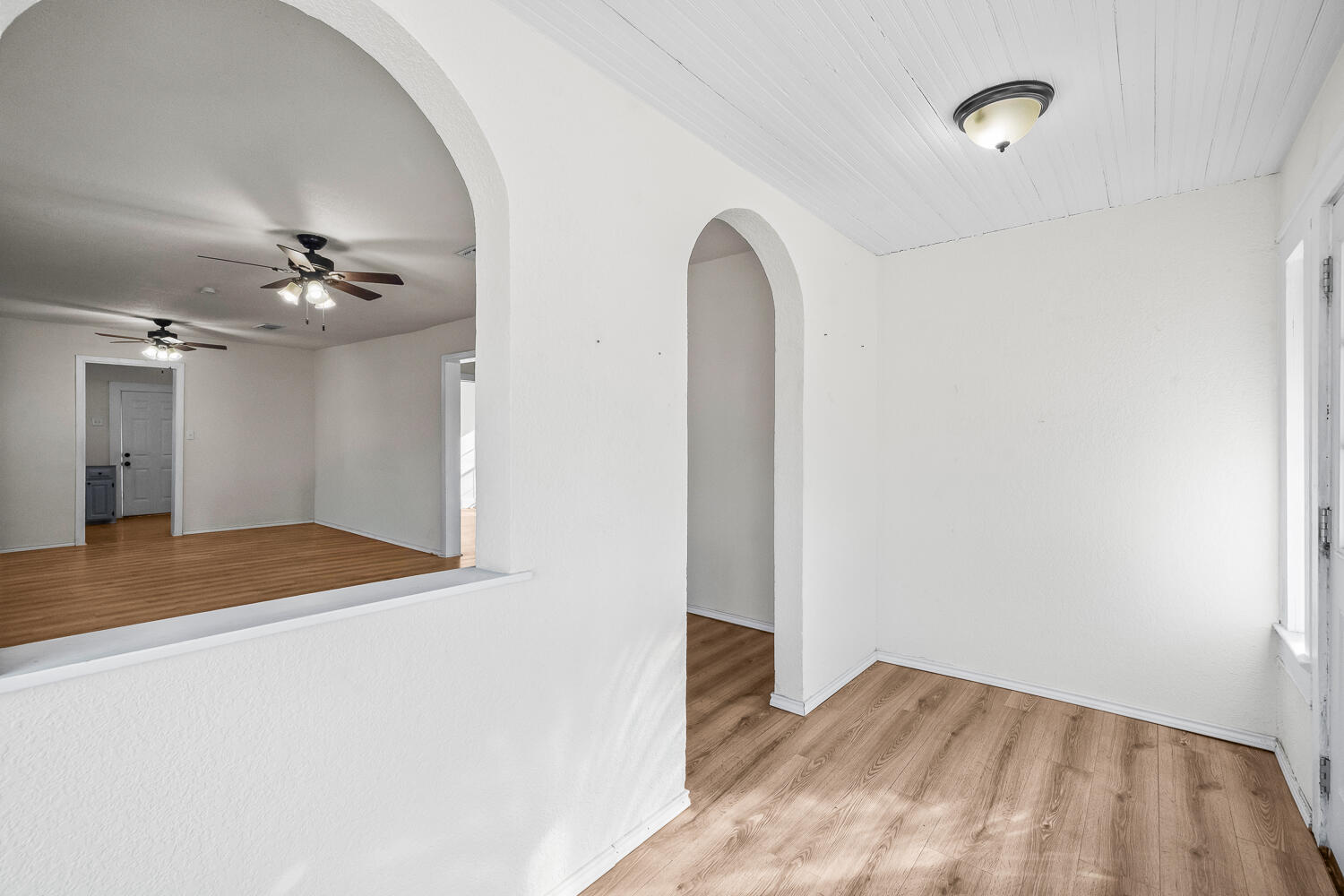 620 South 11th Street Slaton, TX 79364 - Photo 4 of 22 a view of a room with wooden floor