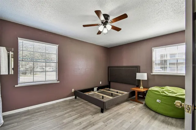 a living room with a bed furniture and a window