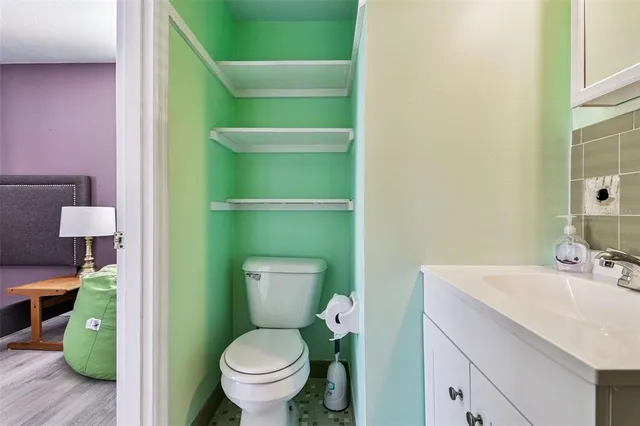 a bathroom with a toilet and a sink