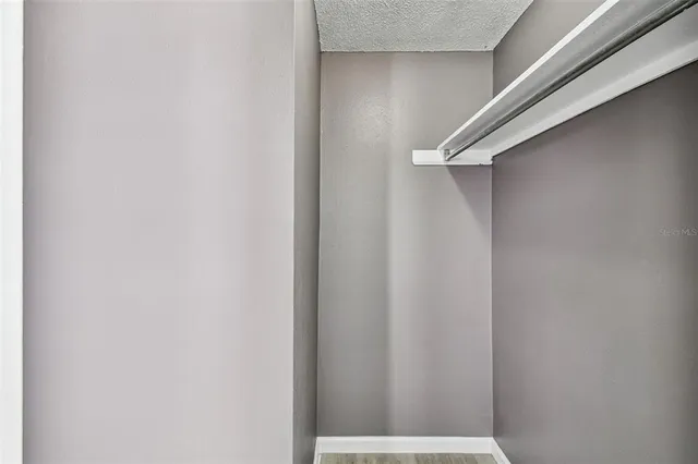 a bathroom with a window and a shower