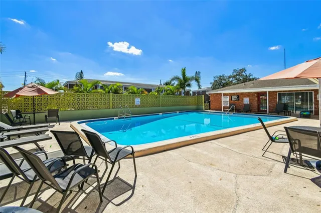 a view of a pool with a yard