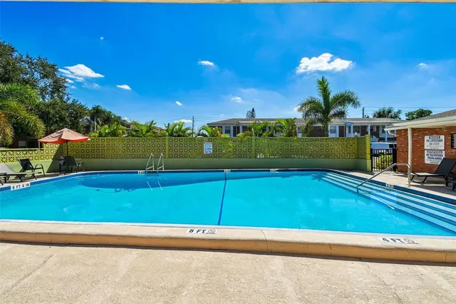 a view of a living room kitchen with furniture and wooden floor