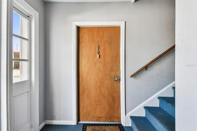 a view of an entryway with wooden floor