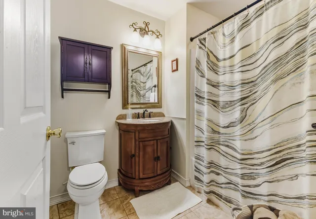 a bathroom with a toilet and a sink