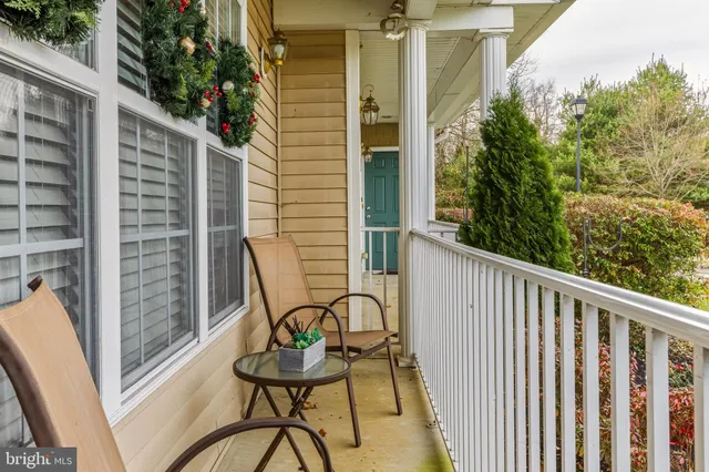 a view of balcony with furniture